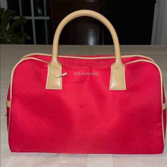 Clarins Handbags - Vintage Clarins Red Bag with Tan Accents